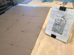 Laying out the clay canvas